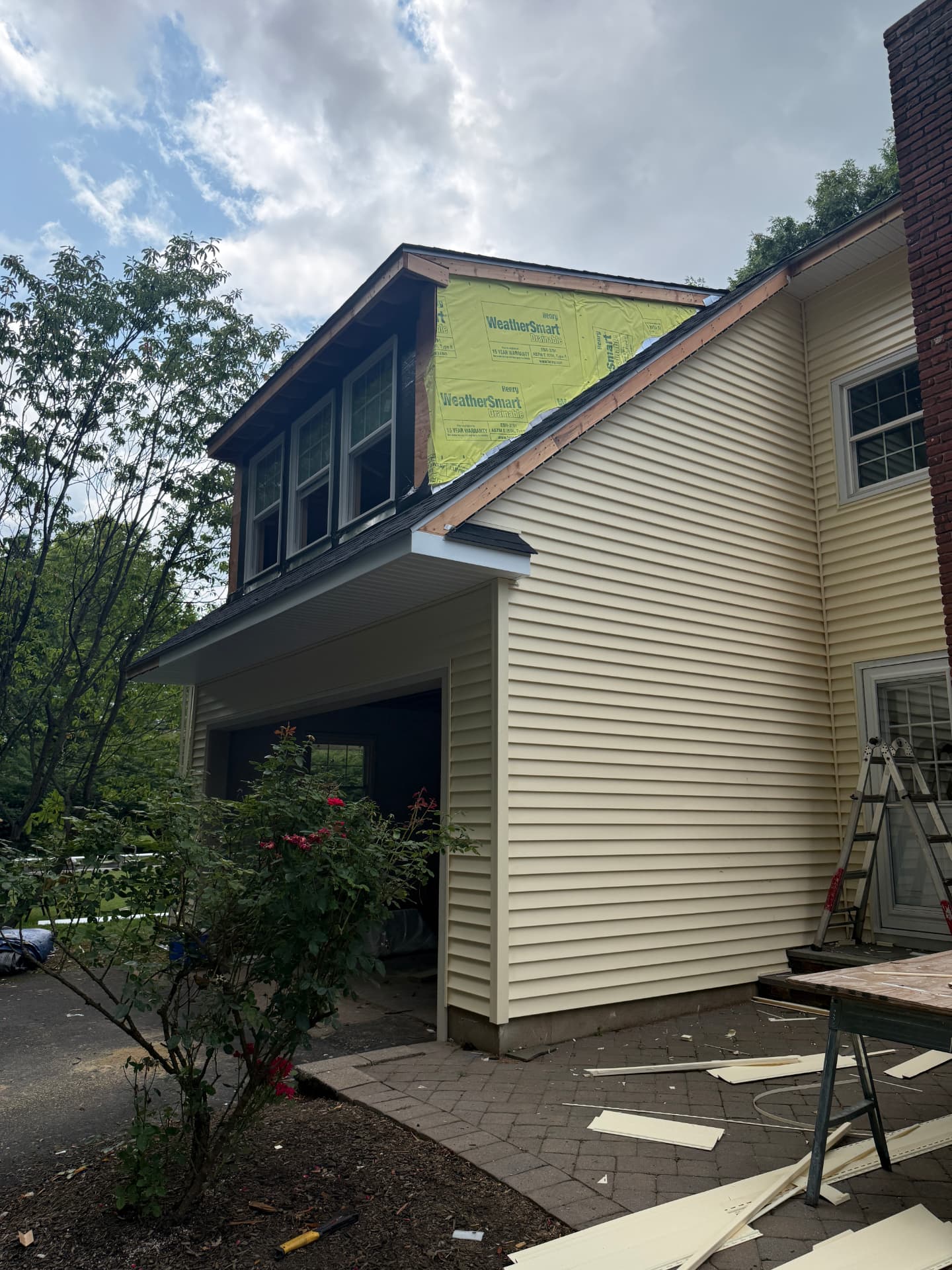 Dormer wrapped in WeatherSmart weather barrier during a siding replacement