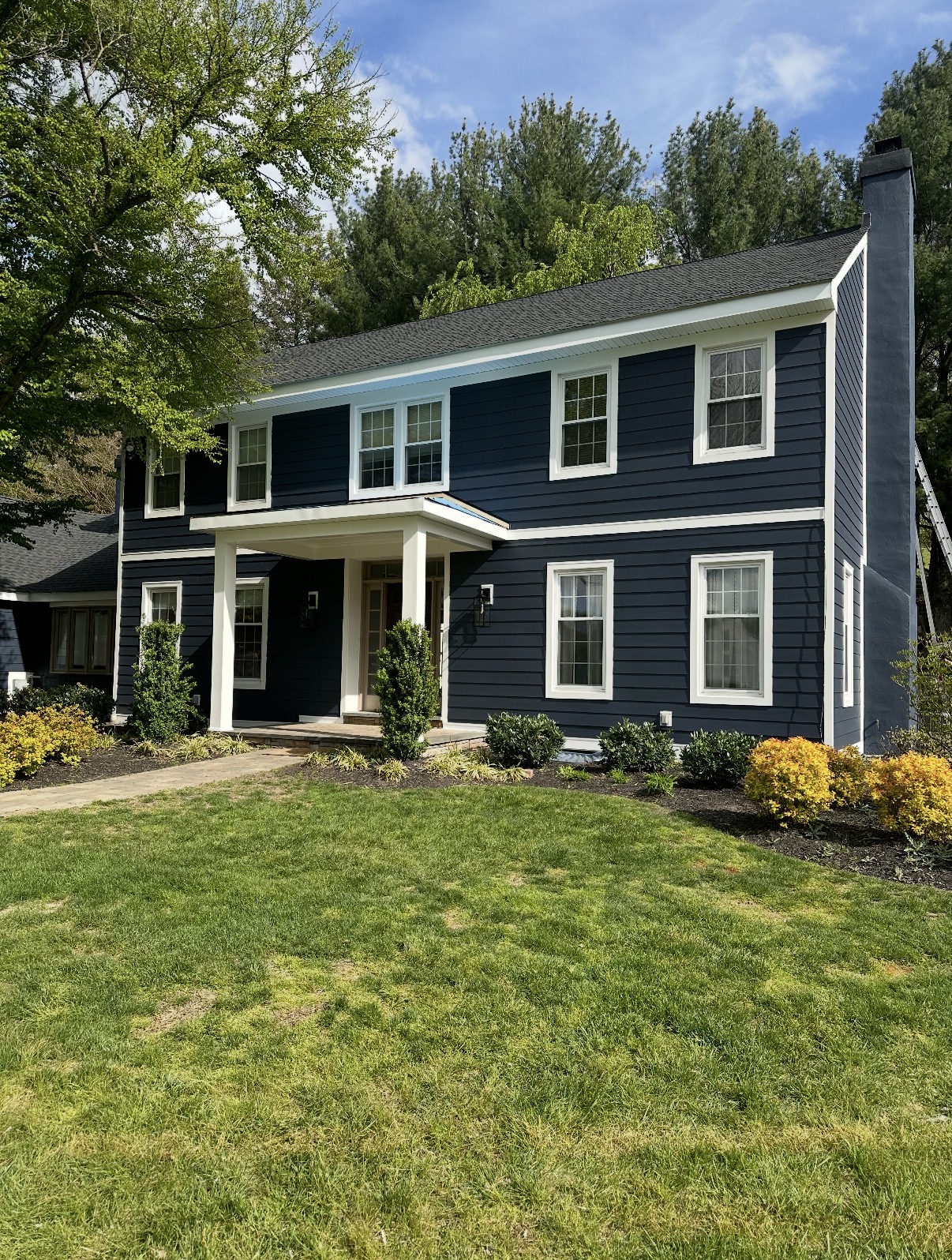 Navy blue Hardie siding colonial home